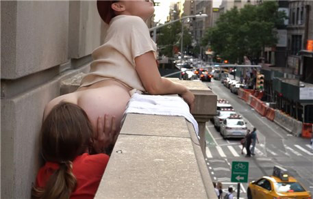 Two girls have fun on the balcony